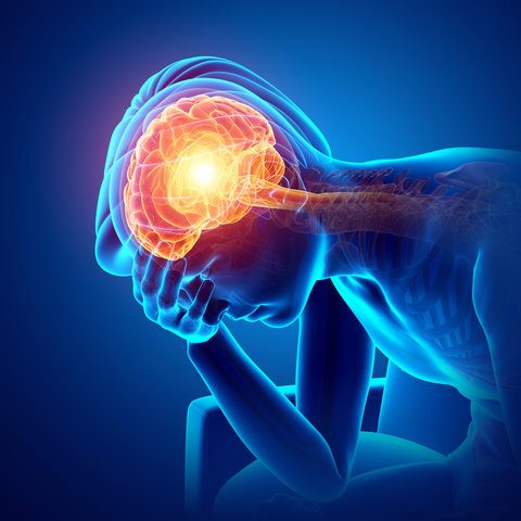 Headache A person in pain, holding their head with a glowing brain illustration nearby.